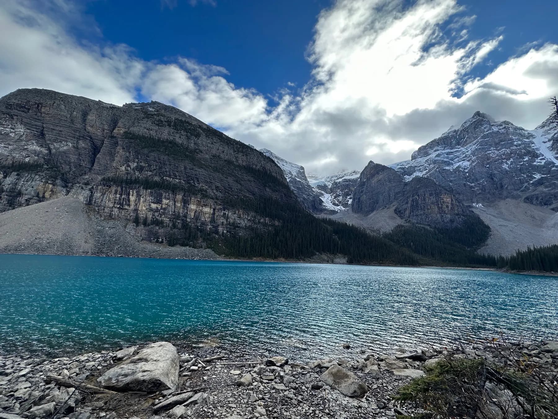 Mountain lake below rocky peaks