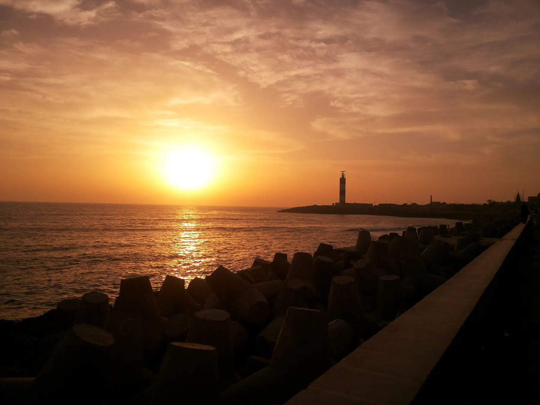 Headland and lighthouse above the ocean