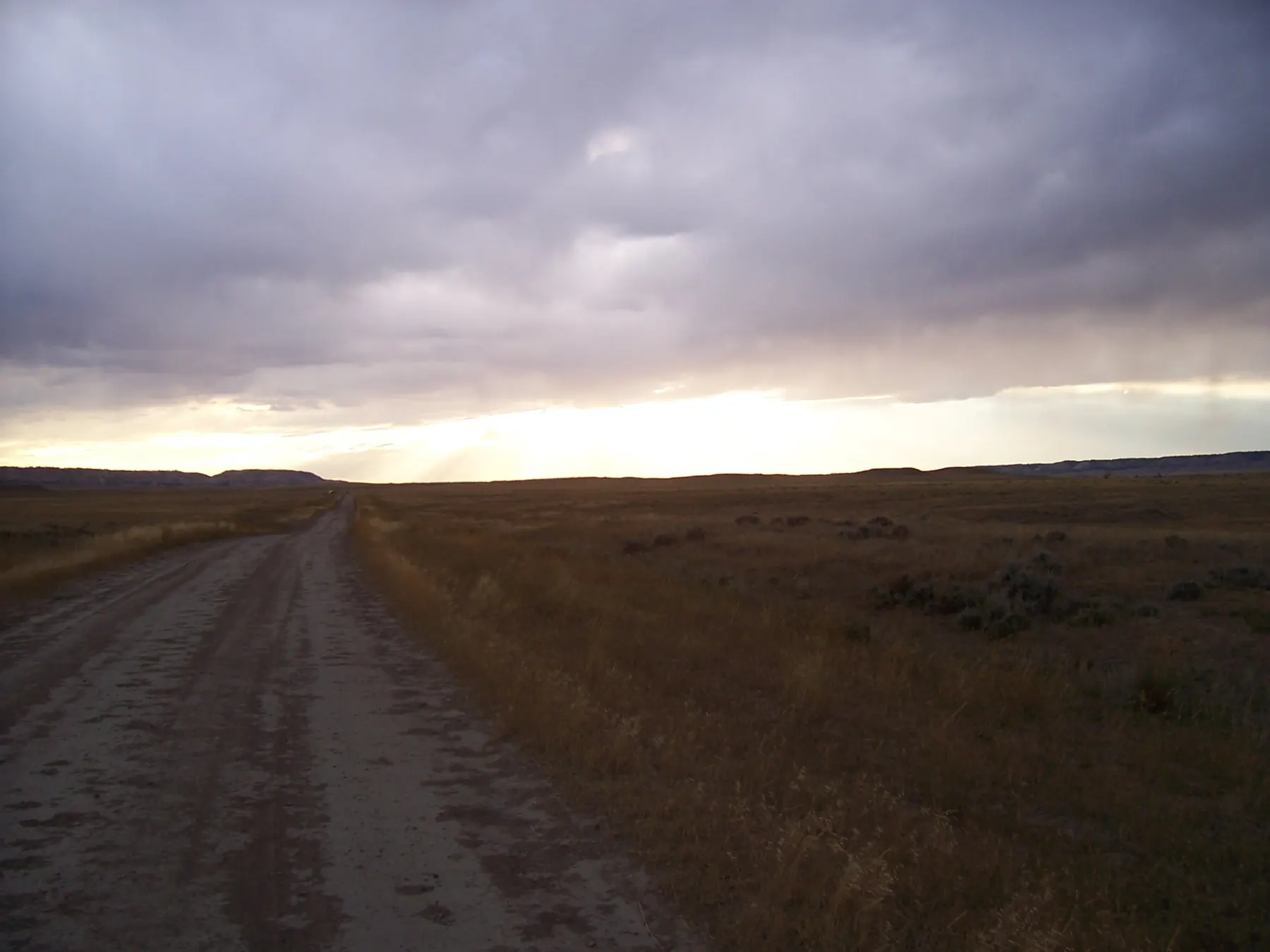 Desert plateau at dusk with purple sky