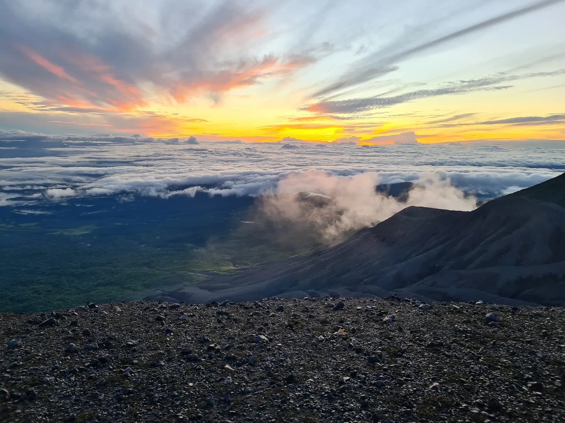 Mountain range at dawn under a clearing sky